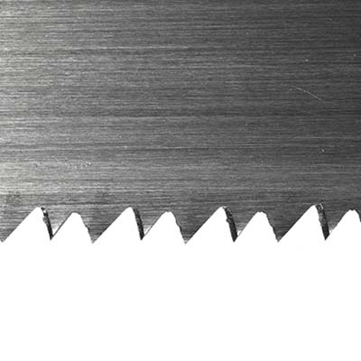 close up of teeth of a crosscut saw
