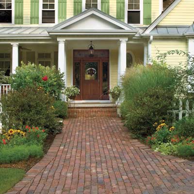 manicured house with welcoming walk