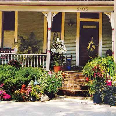 remodeled folk victorian house with curb appeal and welcoming entry
