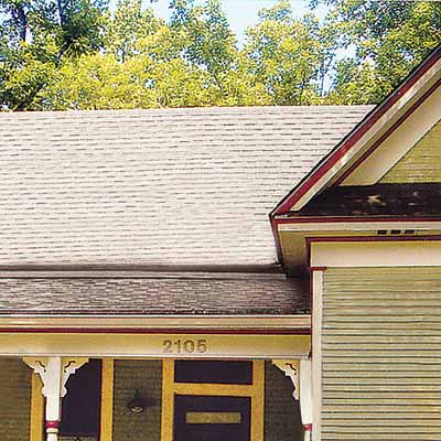 remodeled folk victorian house with curb appeal and asphalt shingled roof

