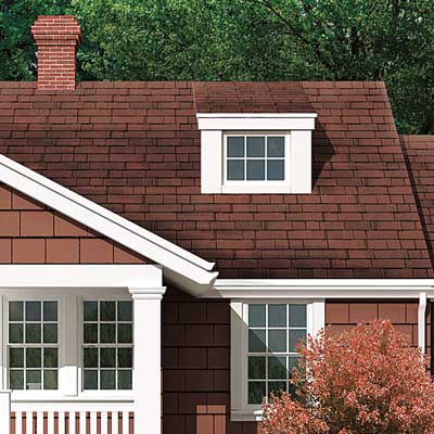 cottage exterior remodel with reporportioned side windows and chimney