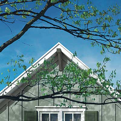 farmhouse with bracketed roof gables