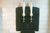 furnace door salvaged into beer tap