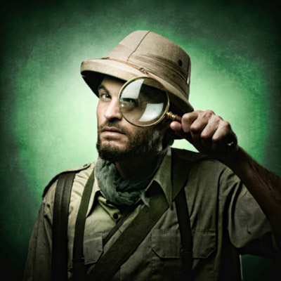 Man holding magnifying glass