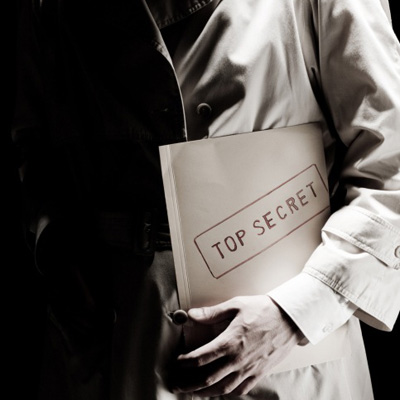 Man holding a top secret folder
