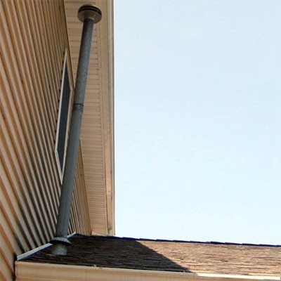water heater chimney located dangerously near house