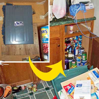 electrical panel hung inside kitchen cupboard