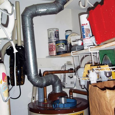 Water heater flue vent pipe near combustibles 