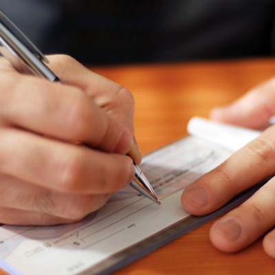 hands writing check
