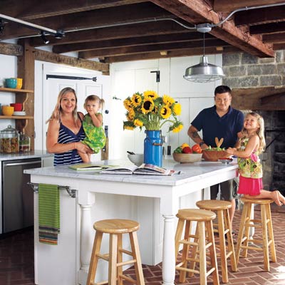 family in remodeled farmhouse kitchen