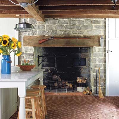 remodeled farmhouse kitchen with stone hearth