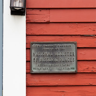  National Register of Historic Places plaque displayed outside the bedford house before this old house remodel
