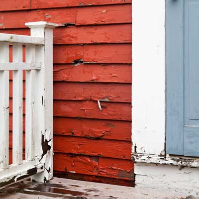 faded and peeling clapboard siding on the bedford house before this old house remodel