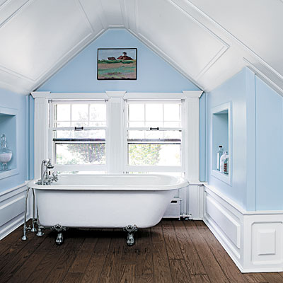 bathroom with blue walls and vaulted ceiling