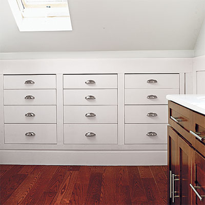 storage recessed into knee walls in this refinished attic 