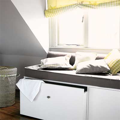 create storage in bumped out window seats in this refinished attic 