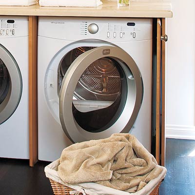 laundry room hidden in kitchen sideboard
