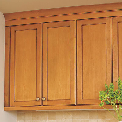 laundry room hidden in kitchen with overhead cabinet storage