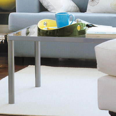 living room with metal and glass coffee table