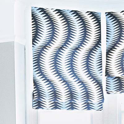 deep and dramatic living room with graphic textiled blinds