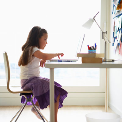 Girl using a computer at a desk