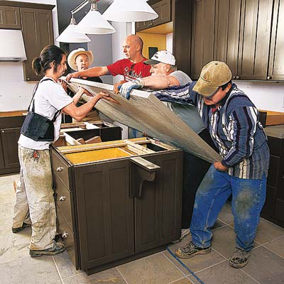 workers building a kitchen island