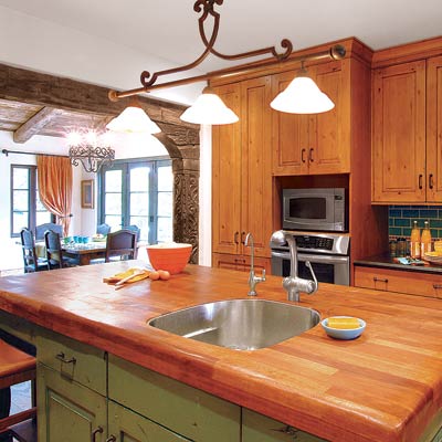a kitchen island with a built-in sink