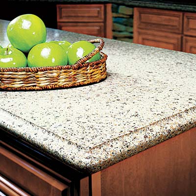 a kitchen island with a stone countertop with green apples