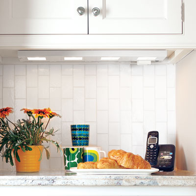 the message center, charging station and serving area in a small kitchen