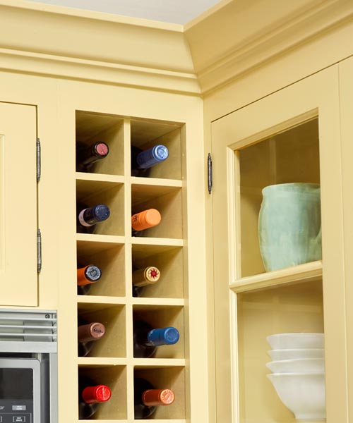built-in wine cubbies after yellow kitchen remodel