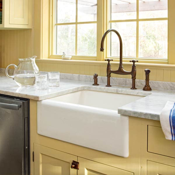 apron sink and beadboard backsplash after yellow kitchen remodel