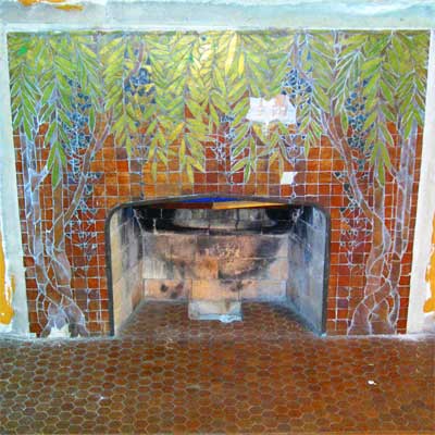 A fireplace surround by artist Orlando Gianni in this saginaw michigan queen anne victorian from save this old house 