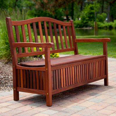 Wooden storage bench pictured on patio