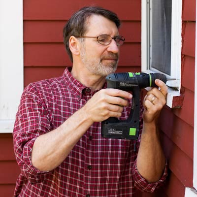 Norm Abram using a cordless drill/driver