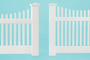 comparison shot of two vinyl picket fences from different price ranges