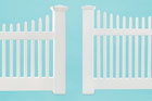 comparison shot of two vinyl picket fences from different price ranges