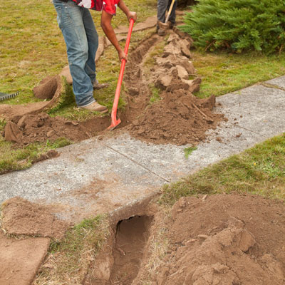 Dig the inlet trench and lay plastic pipe for the garden area