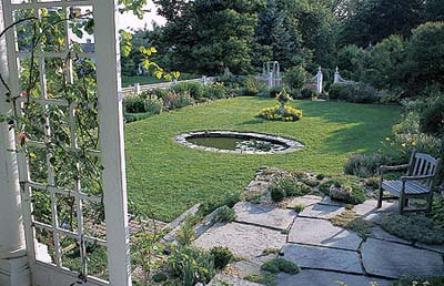 flagstone terrace, alpine plants and pond in Litchfield, Connecticut, garden