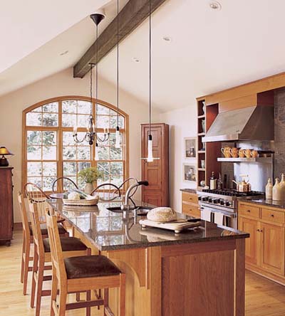 kitchen zones distinguished by lighting fixtures