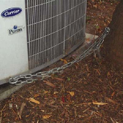 air conditioner chained to a tree