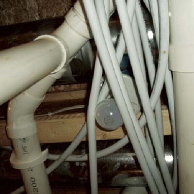 water pipes wrapped around ceiling light fixture