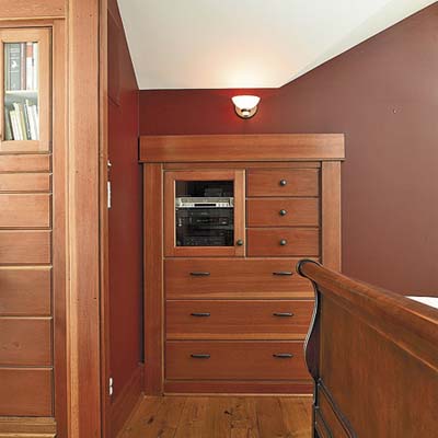 built-in storage in master bedroom of remodeled houseboat