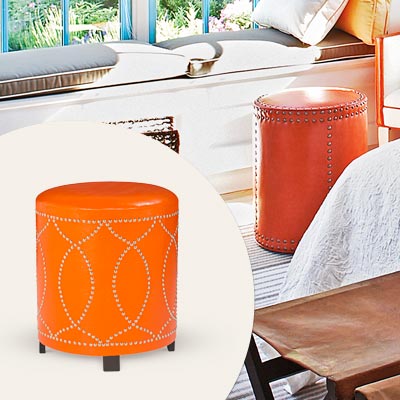 orange faux leather ottoman with nailhead trim