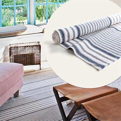 faded blue and white striped cotton rug