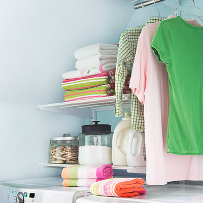 a laundry room with a hanging rod