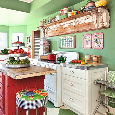 kitchen with a green wall 