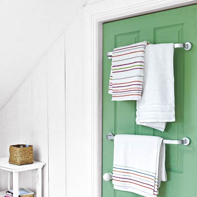 white bathroom with a green door