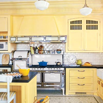 kitchen with a yellow island and cabinets