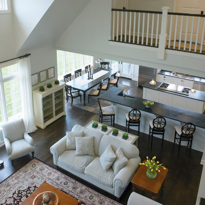 looking down into a great room that leads into a kitchen 