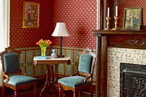1879 parlor with paint stenciling to look like period wallpaper